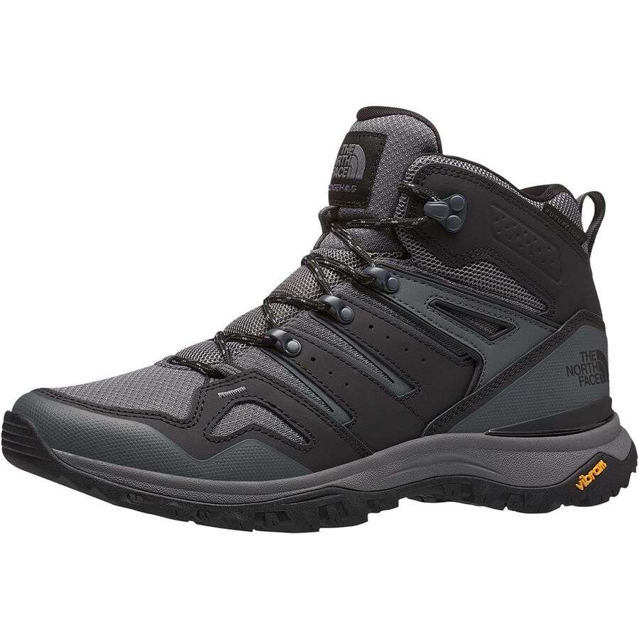 “Men's mid-cut waterproof hiking boots featuring a leather and synthetic upper with a breathable FUTURELIGHT™ membrane, lace-up closure, reinforced toe cap, cushioned EVA midsole, padded collar, and a durable rubber outsole with aggressive trail lugs