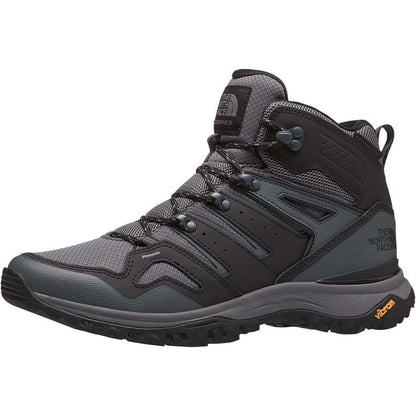 “Men's mid-cut waterproof hiking boots featuring a leather and synthetic upper with a breathable FUTURELIGHT™ membrane, lace-up closure, reinforced toe cap, cushioned EVA midsole, padded collar, and a durable rubber outsole with aggressive trail lugs