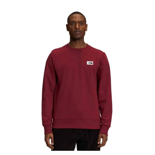 The North Face Men’s Heritage Patch Crew featuring classic crewneck design, soft fleece fabric, ribbed trim, and heritage logo patch detail.