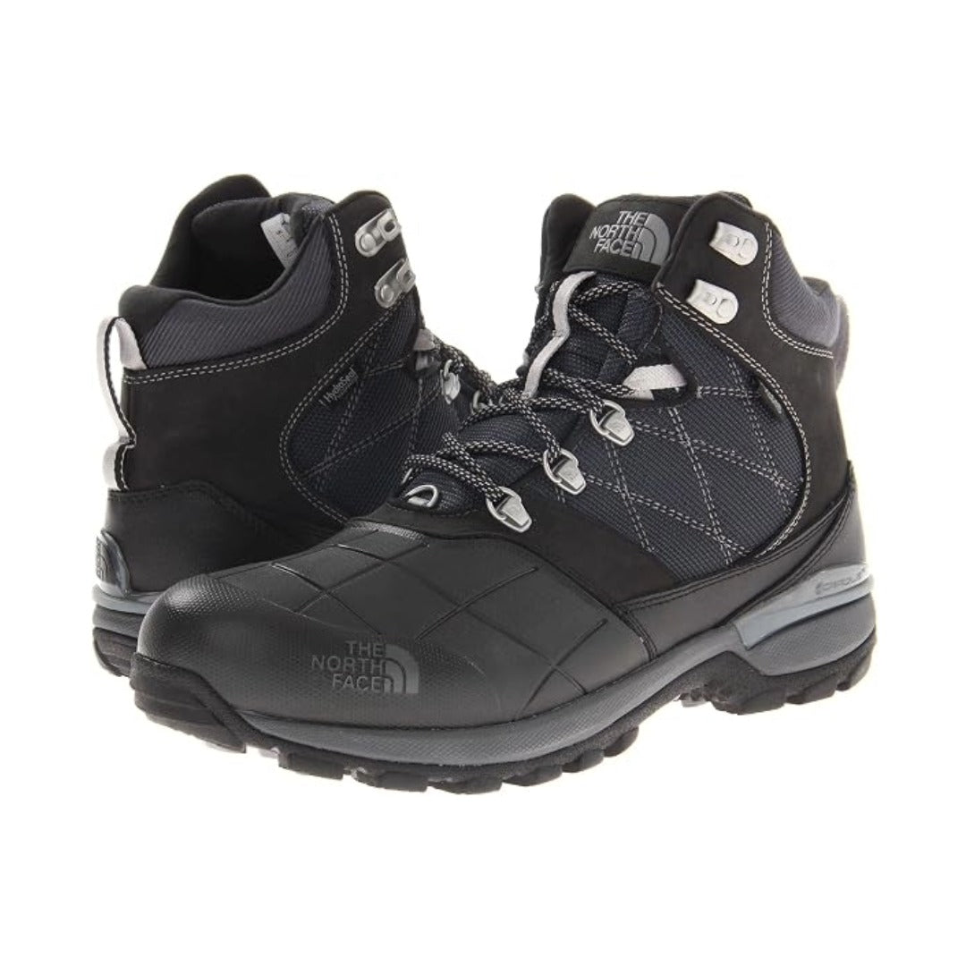 Men's insulated winter boots featuring a waterproof synthetic and textile upper, lace-up closure, padded collar, cushioned midsole, reinforced toe and heel, and durable rubber outsole with rugged tread for snowy and cold-weather conditions