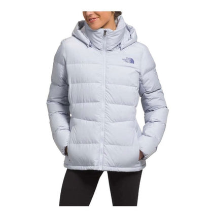 The North Face Metropolis Jacket featuring long insulated design, attached hood, and sleek silhouette for warm, stylish winter wear in urban and cold-weather settings.