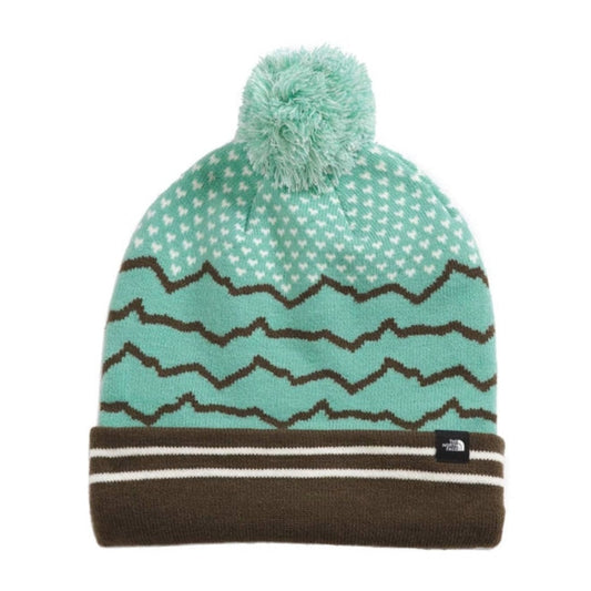 Front view of The North Face Ski Tuke knit winter beanie with cuffed design, vibrant jacquard pattern, and a pom on top.