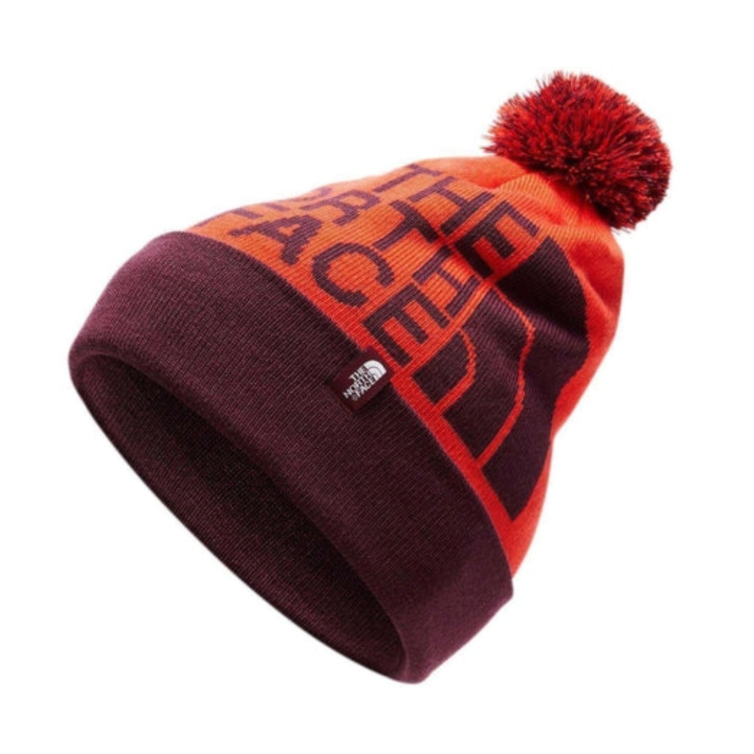 The North Face Ski Tuke V knit winter beanie with cuffed design, jacquard pattern, and pom-pom top.