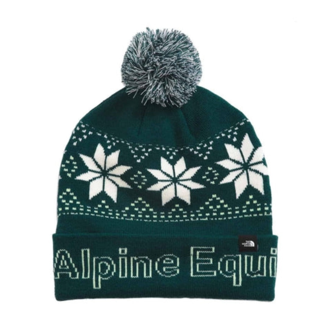 Front view of The North Face Ski Tuke knit winter beanie with cuffed design, vibrant jacquard pattern, and a pom on top.