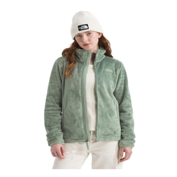 Woman wearing a North Face Osito fleece jacket with a full-zip front and plush texture, designed for warmth and comfort in cool weather.