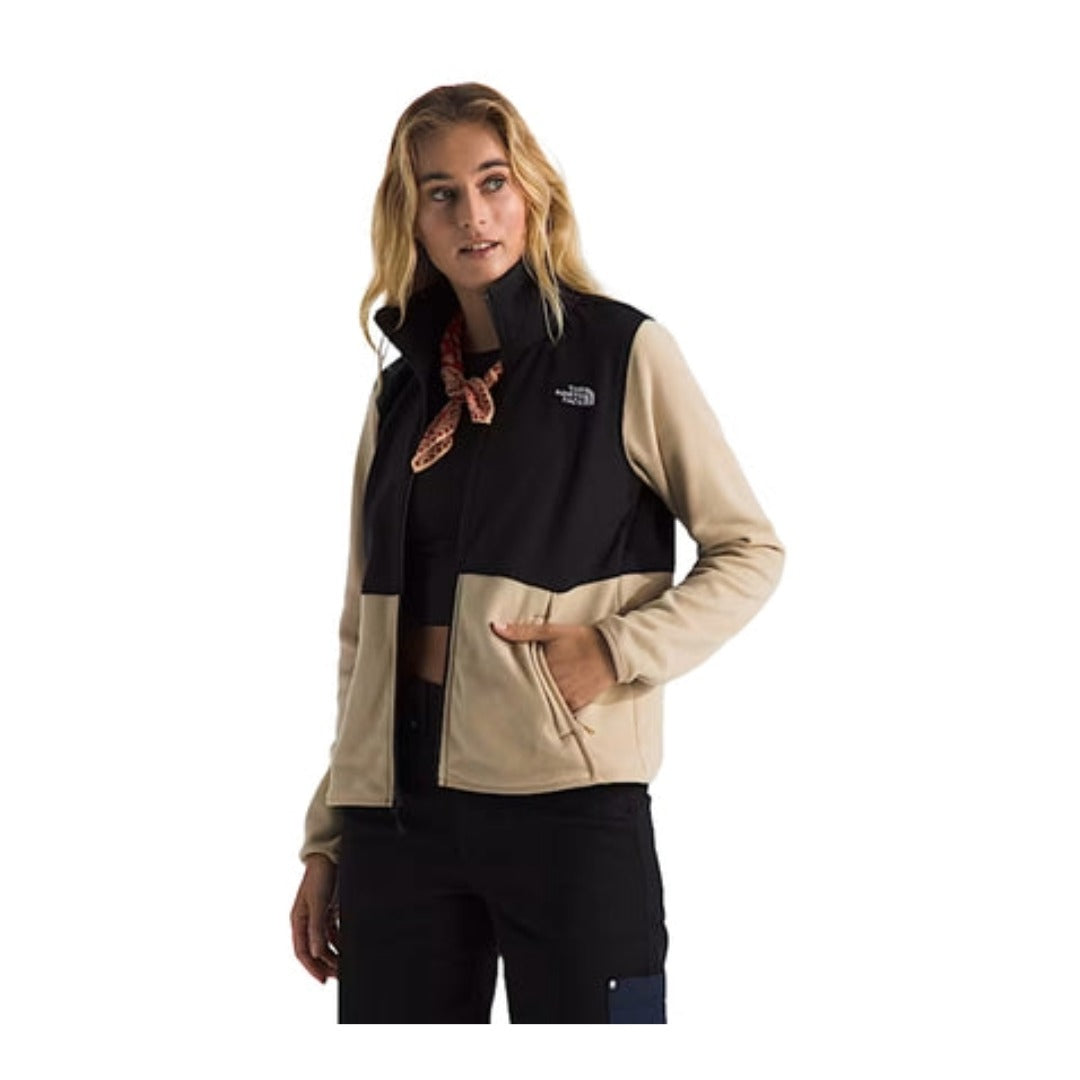 Woman wearing a North Face Glacier fleece jacket with a full-zip front and stand collar, designed for lightweight warmth and everyday use.