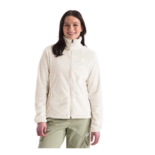 Woman wearing a North Face Osito fleece jacket with a full-zip front and plush texture, designed for warmth and comfort in cool weather.