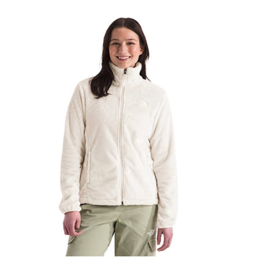 Woman wearing a North Face Osito fleece jacket with a full-zip front and plush texture, designed for warmth and comfort in cool weather.