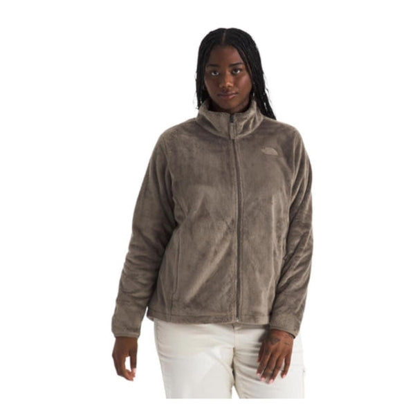 Woman wearing a North Face Osito  jacket with a full-zip front and plush texture, designed for warmth and comfort in cool weather.