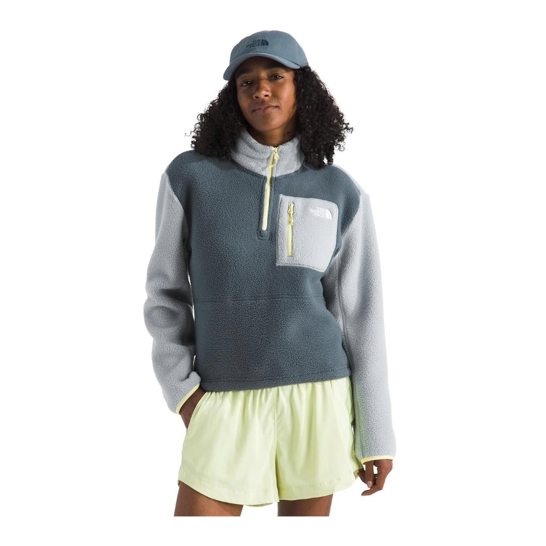 Woman wearing The North Face Yumiori quarter zip jacket, showing a soft fleece texture and relaxed fit.