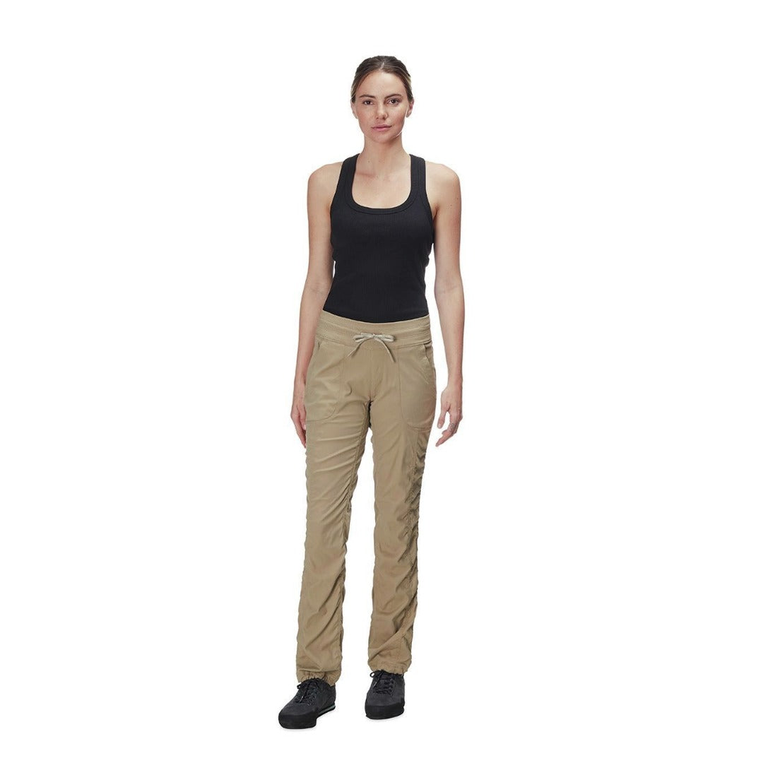 The North Face Women’s Aphrodite Pants with lightweight stretch fabric, adjustable waistband, and water-repellent finish for travel, hiking, and everyday comfort.
