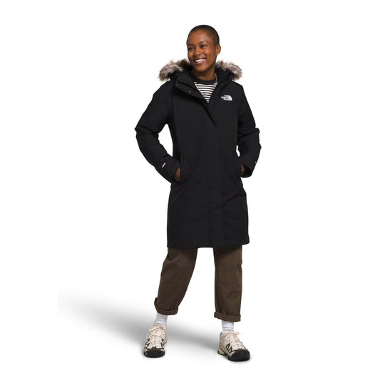 Women’s long insulated winter parka featuring a water-repellent outer shell, warm insulation, adjustable hood with faux-fur trim, full-length front zipper, storm flap, multiple pockets, and adjustable cuffs for cold-weather protection