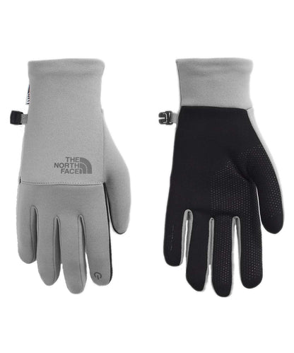The North Face Women’s Etip Recycled Gloves featuring stretch fleece fabric, touchscreen-compatible fingertips, and silicone grip palm for everyday cold-weather use.