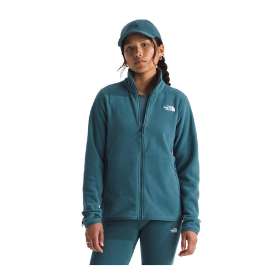 Woman wearing a North Face Glacier fleece jacket with a full-zip front and stand collar, designed for lightweight warmth in cool conditions.