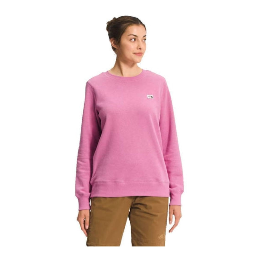 The North Face Women’s Heritage Patch Crew featuring soft fleece fabric, ribbed trim, and stitched heritage logo patch on a classic crewneck sweatshirt.