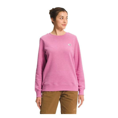 The North Face Women’s Heritage Patch Crew featuring soft fleece fabric, ribbed trim, and stitched heritage logo patch on a classic crewneck sweatshirt.