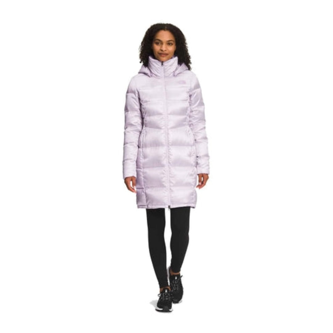 The North Face Women’s Metropolis Parka featuring long quilted design, hooded silhouette, and lightweight down insulation for winter warmth.