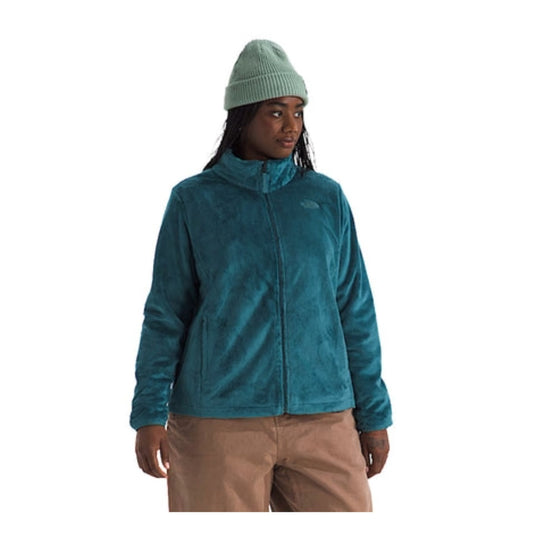 Woman wearing a North Face Osito fleece jacket with a full-zip front and plush texture, designed for warmth and comfort in cool weather.