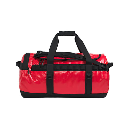 The North Face Base Camp Duffel – M in classic black with top handles, adjustable shoulder straps, and zippered D-closure design.
