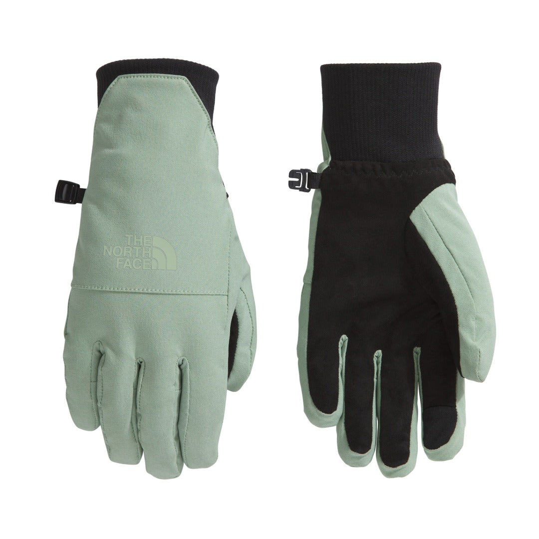 The North Face Women’s Shelbe Raschel Etip Gloves in black with logo detail, featuring a fleece lining and touchscreen-compatible fingertips.