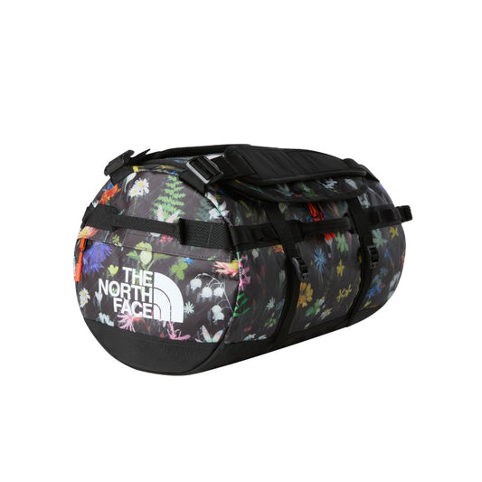 The North Face Base Camp Duffel - S in yellow and black, featuring padded handles, detachable shoulder straps, and a secure D-zip closure.