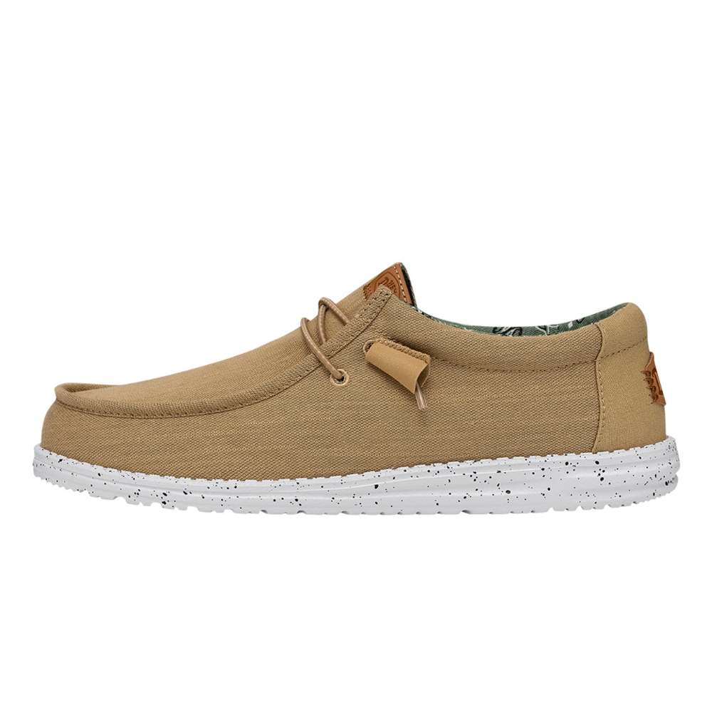 A pair of Hey Dude Men's Wally Washed Canvas shoes in walnut
