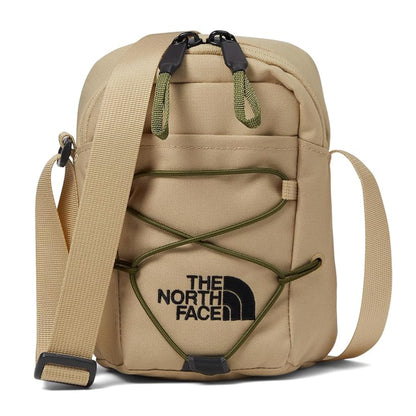 The North Face Jester Crossbody in black, featuring a compact design with multiple compartments and an adjustable strap.