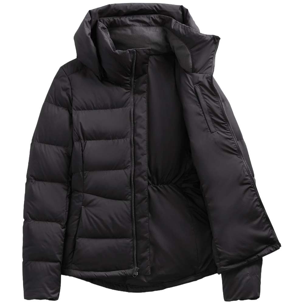 A stylish North Face Women's Metropolis Jacket in sleek black, worn by a woman against a snowy backdrop.
