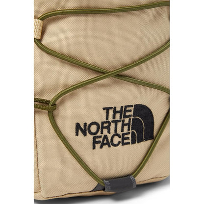 The North Face Jester Crossbody in black, featuring a compact design with multiple compartments and an adjustable strap.