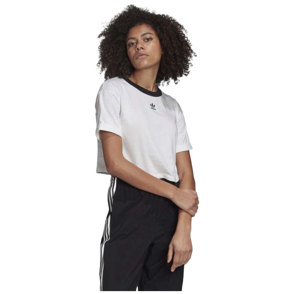 A close-up image of a woman wearing an adidas Originals Women's Cropped Top in a vibrant color, with the adidas logo prominently displayed.