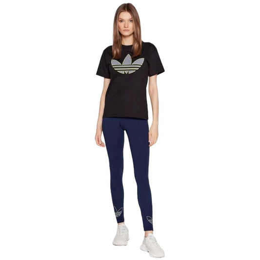 A close-up image of a woman wearing adidas Originals Women's Leggings in a stylish pattern, featuring the adidas logo.