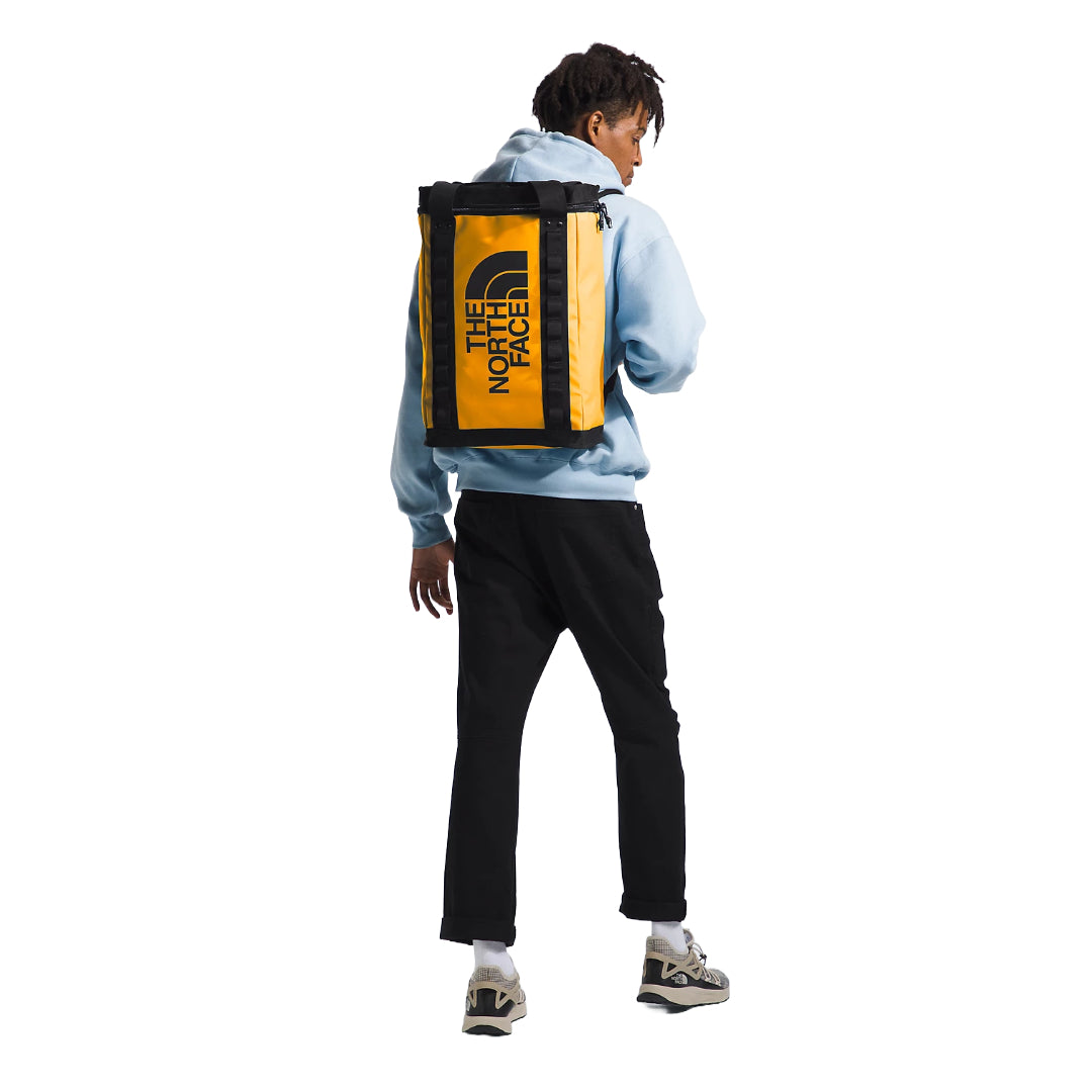 The North Face Explore Fusebox—L in black, featuring a rugged design, spacious interior, and adjustable shoulder straps.