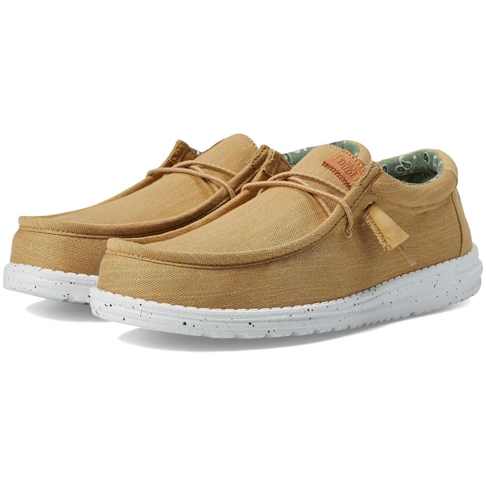 A pair of Hey Dude Men's Wally Washed Canvas shoes in walnut
