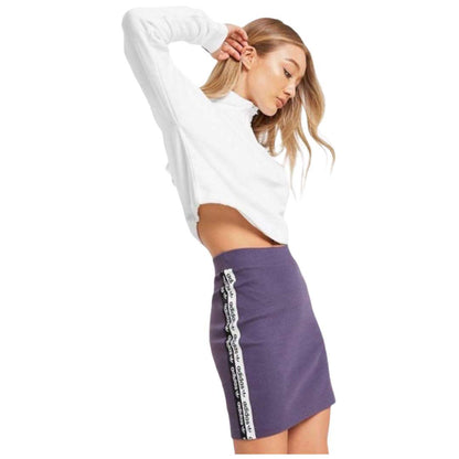 A stylish view of the adidas Originals Women's Tape Skirt in trace purple.