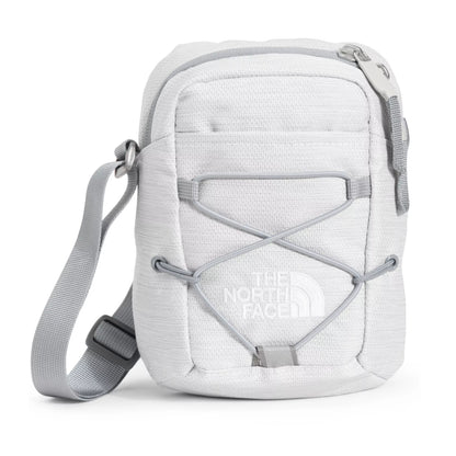 The North Face Jester Crossbody in black, featuring a compact design with multiple compartments and an adjustable strap.