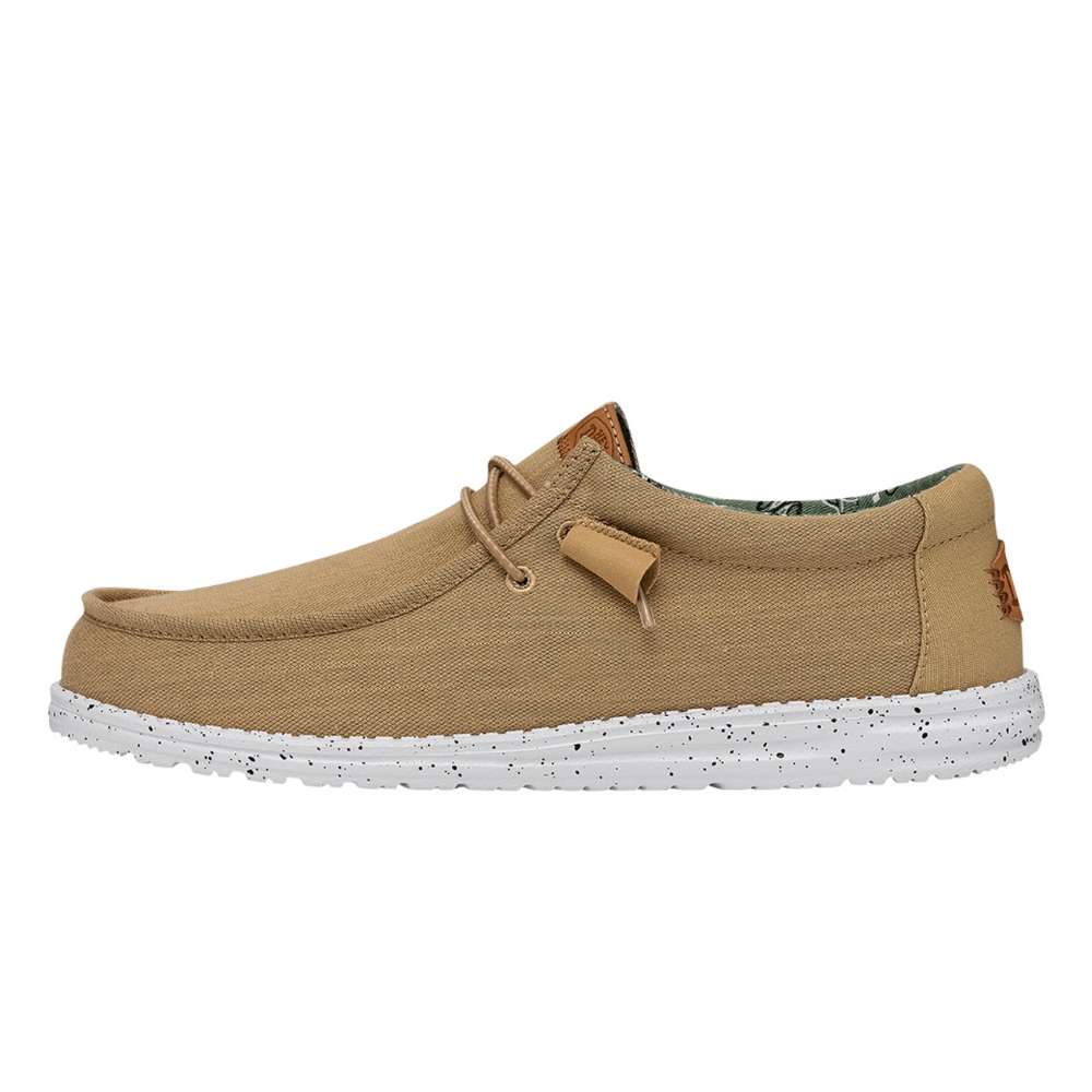 A pair of Hey Dude Men's Wally Washed Canvas shoes in walnut
