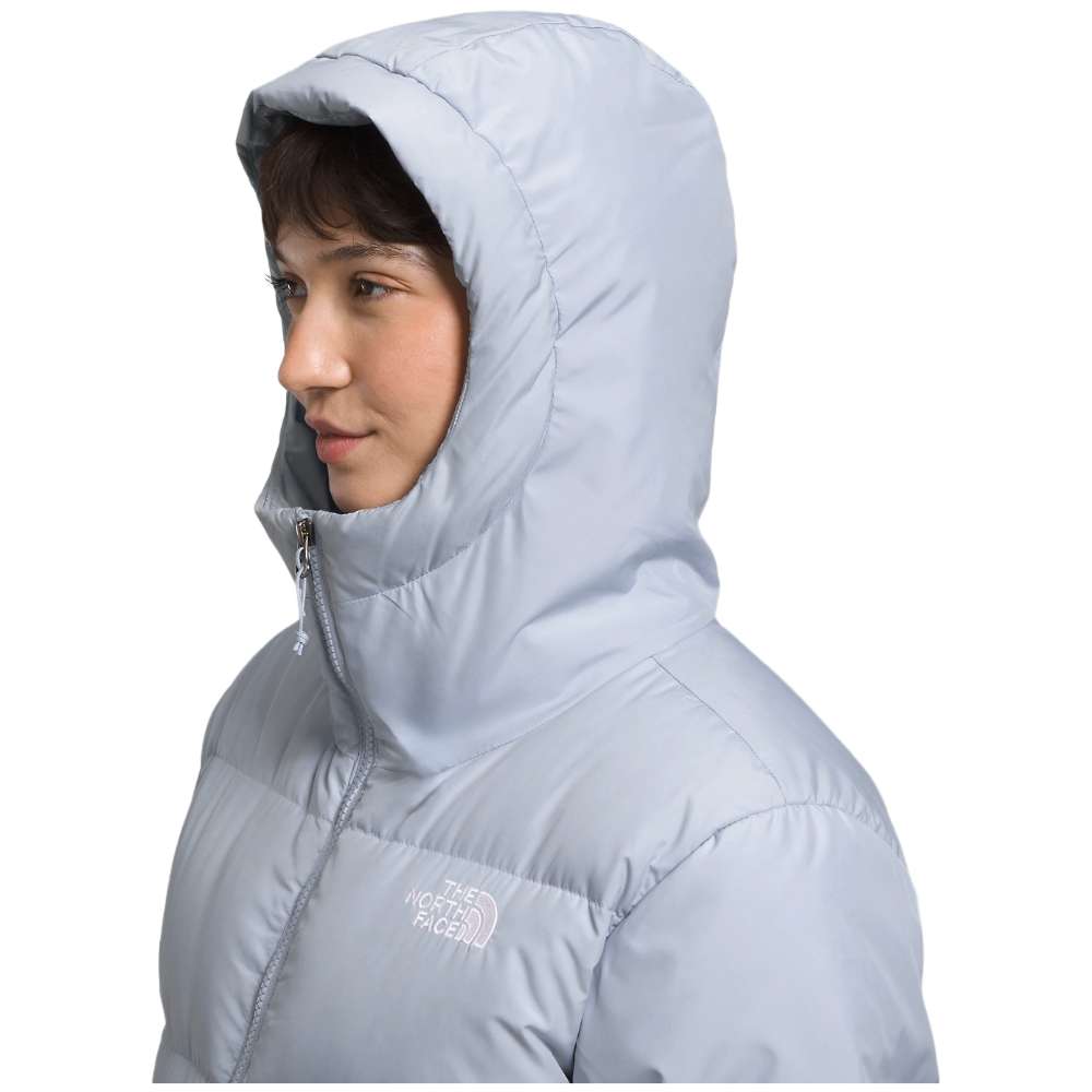 A dusty Periwinkl north face women's triple c parka worn by women.