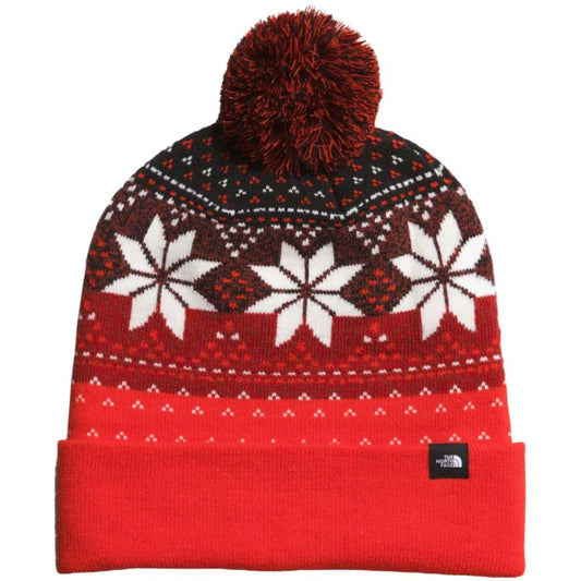 A striking North Face Ski Tuke in Fiery Red/TNF Black, ready for winter adventures.
