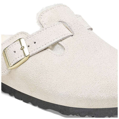 A pair of Birkenstock Boston VL Shearling sandals in antique white.
