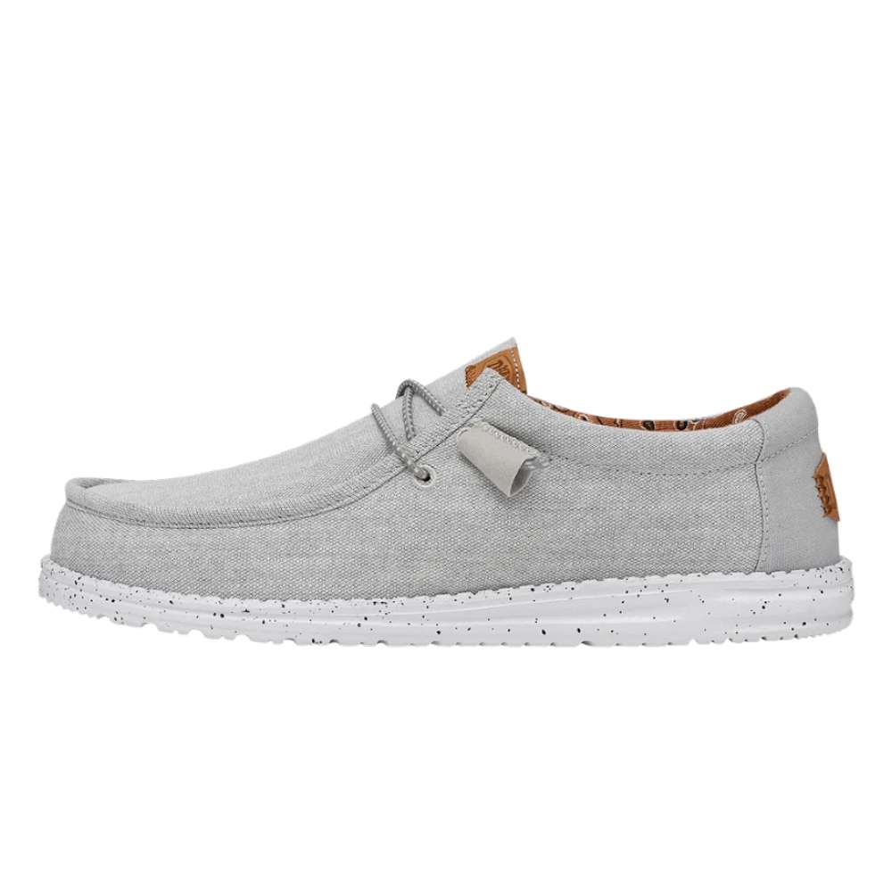 A pair of Hey Dude Men's Wally Washed Canvas shoes in Light Grey
