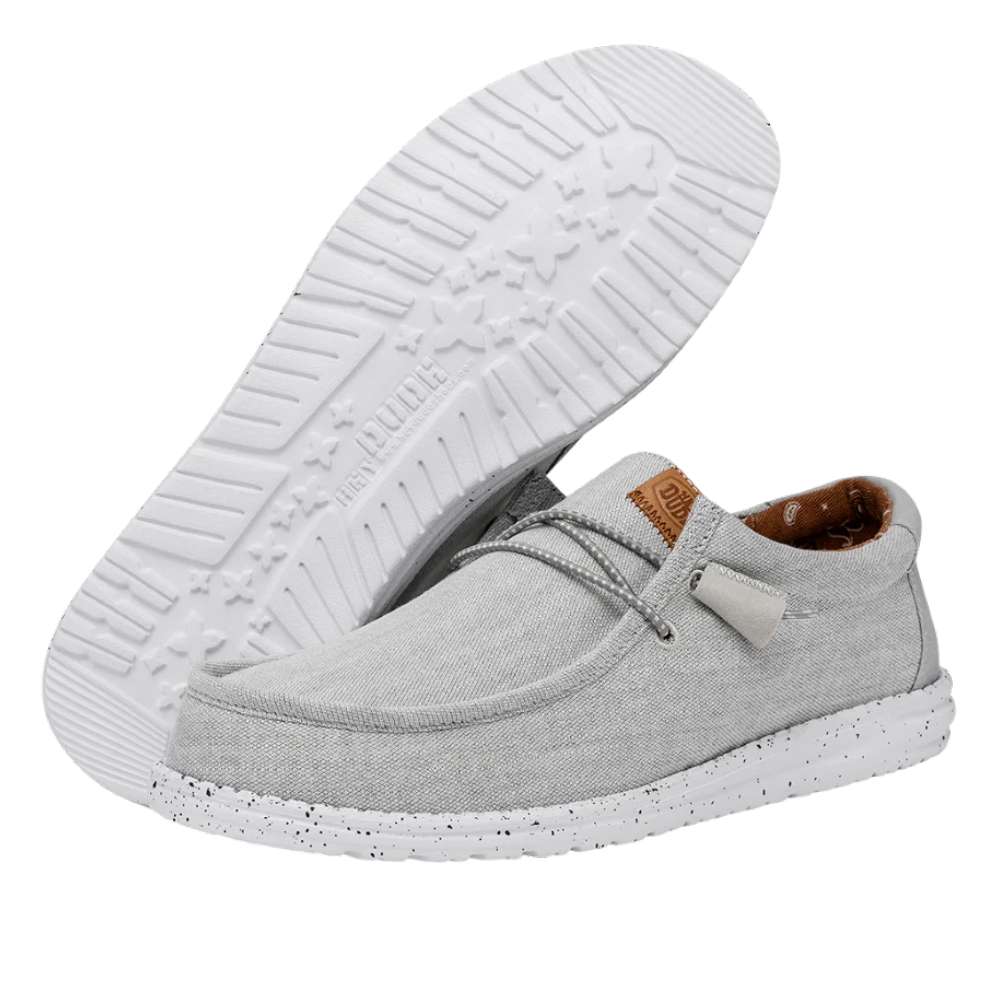 A pair of Hey Dude Men's Wally Washed Canvas shoes in Light Grey