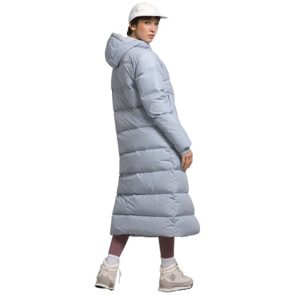 A dusty Periwinkl north face women's triple c parka worn by women.