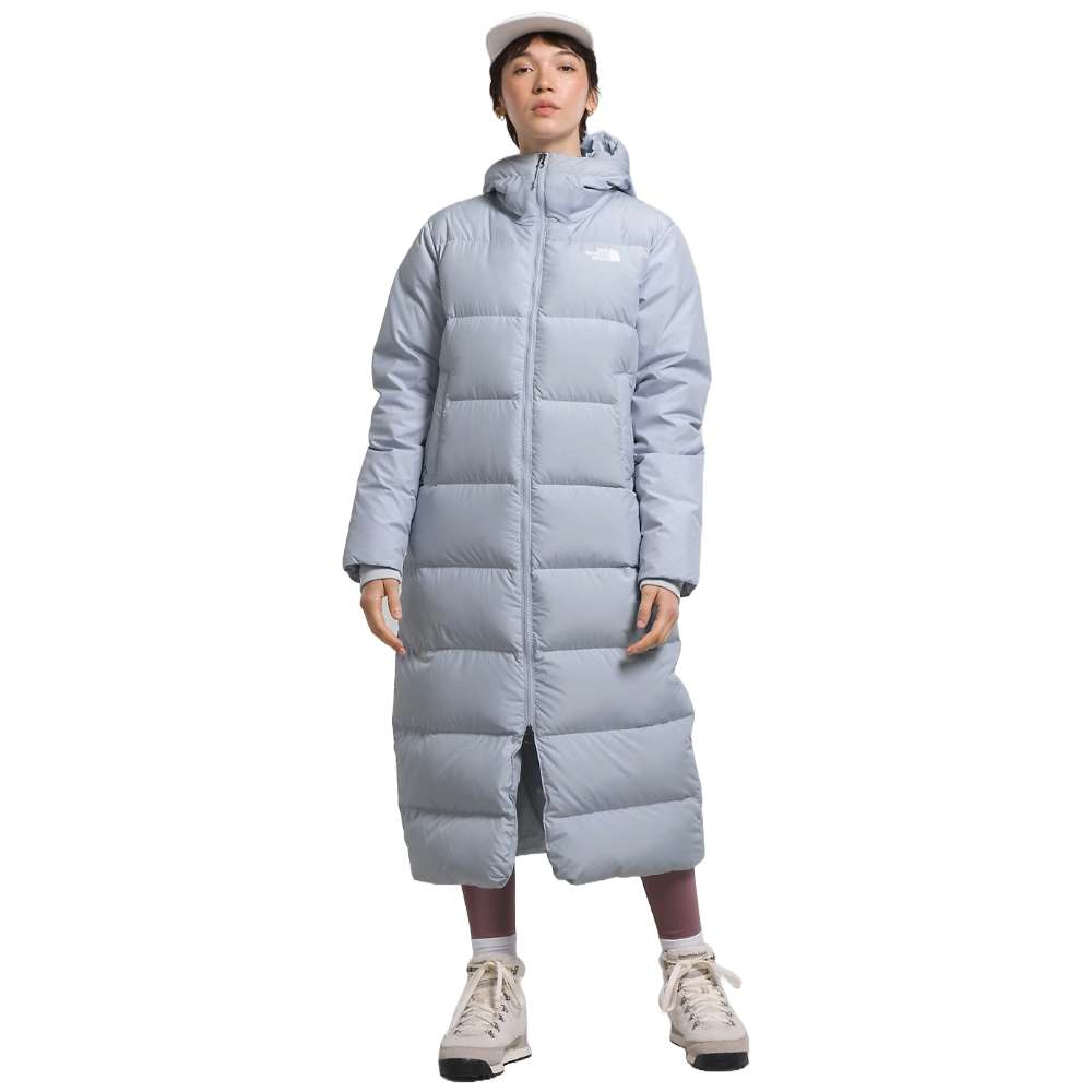 A dusty Periwinkl north face women's triple c parka worn by women.