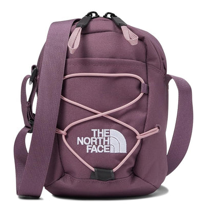 The North Face Jester Crossbody in black, featuring a compact design with multiple compartments and an adjustable strap.