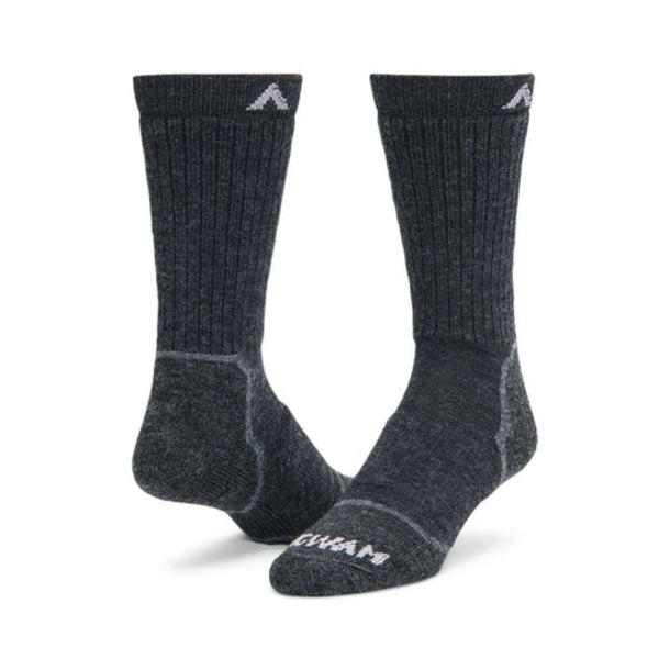 Wigwam Men’s Snow Sirocco knee-high ski socks featuring merino wool-blend construction, lightweight cushioning, and performance winter styling for skiing and snowboarding.