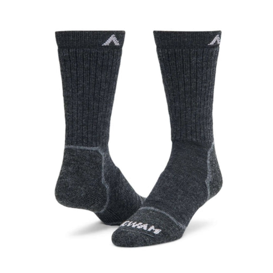 Wigwam Men’s Snow Sirocco knee-high ski socks featuring merino wool-blend construction, lightweight cushioning, and performance winter styling for skiing and snowboarding.