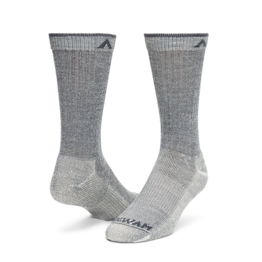 Wigwam men’s merino wool hiking socks in crew length with cushioned knit design, providing warmth, support, and durability for outdoor activities
